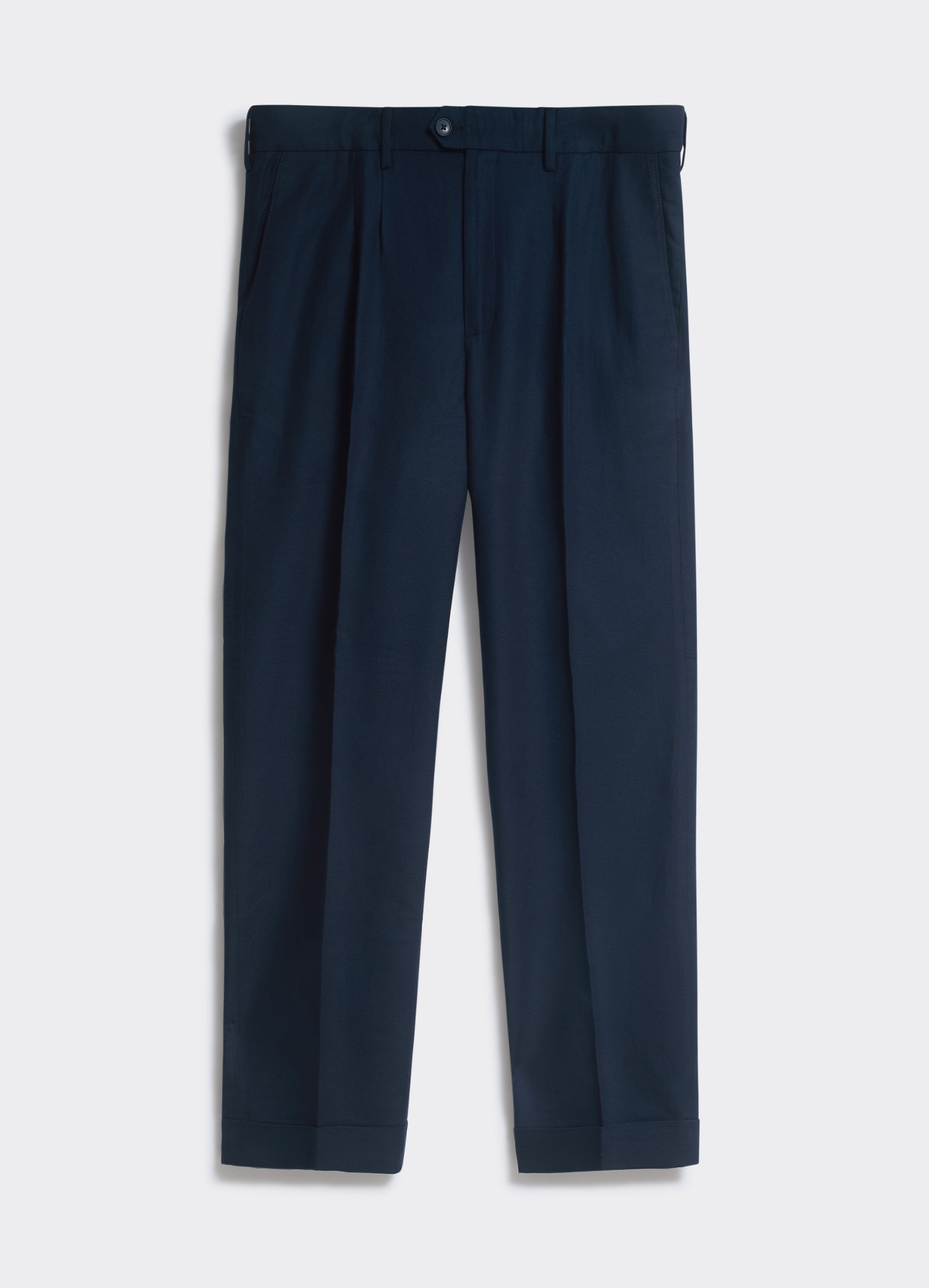Percival Twin Pleated Trousers in navy linen, with twin front pleats and cuffed hems, displayed against a white background.