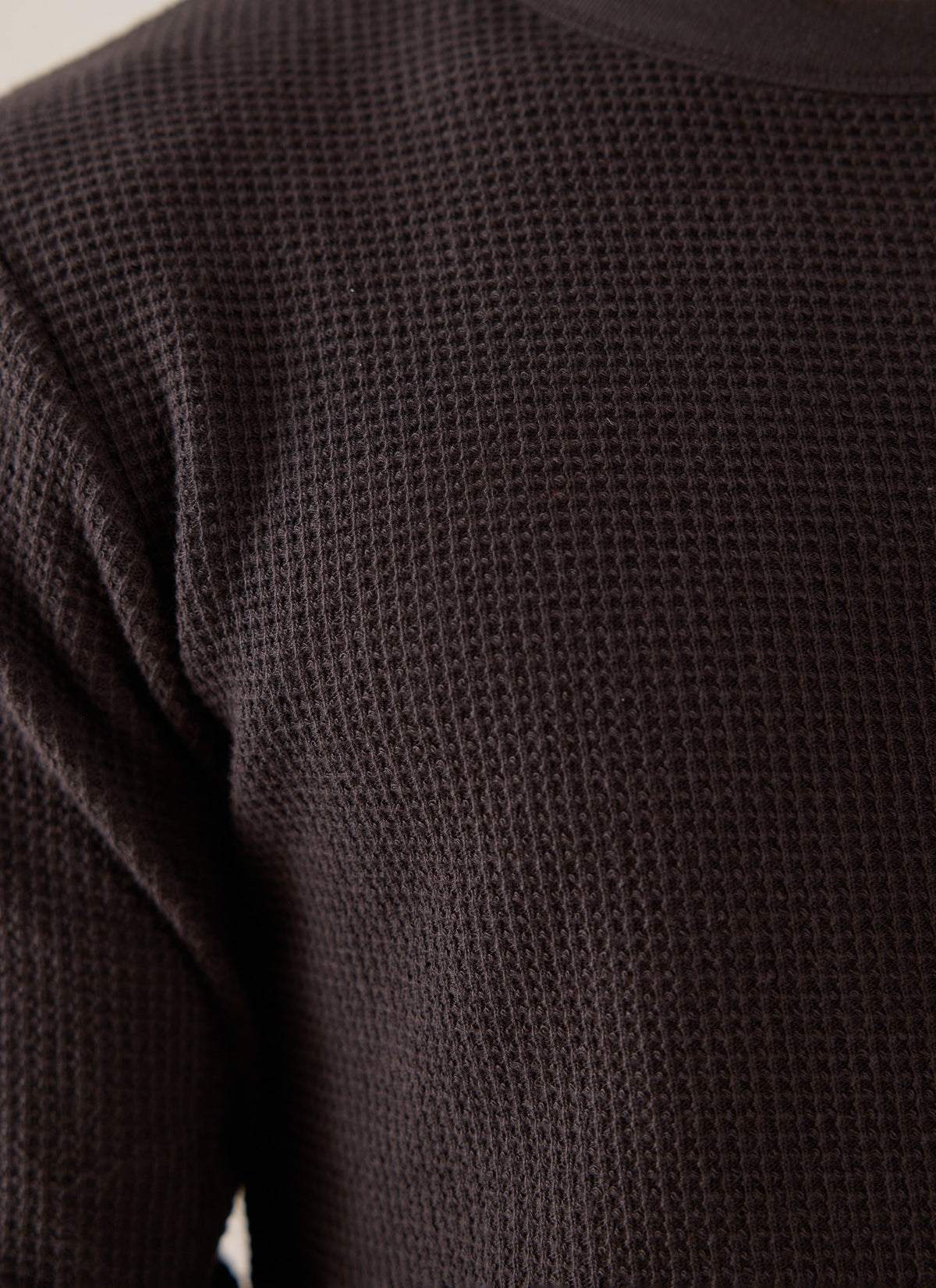 A close-up of the Percival brown waffle long sleeve T-shirt, highlighting the textured 100% cotton fabric and crew neck.
