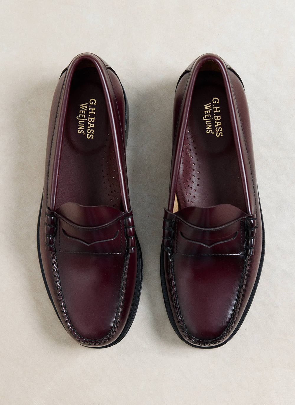 G.H. Bass Weejun Larson penny loafers in wine polished leather, shown from a top-down view.