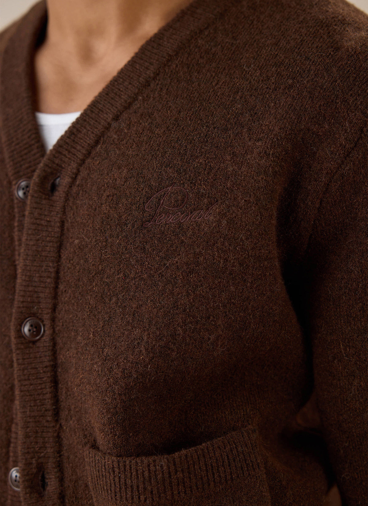 Close-up of espresso brown Percival mohair cardigan, showing chest embroidery and button placket.