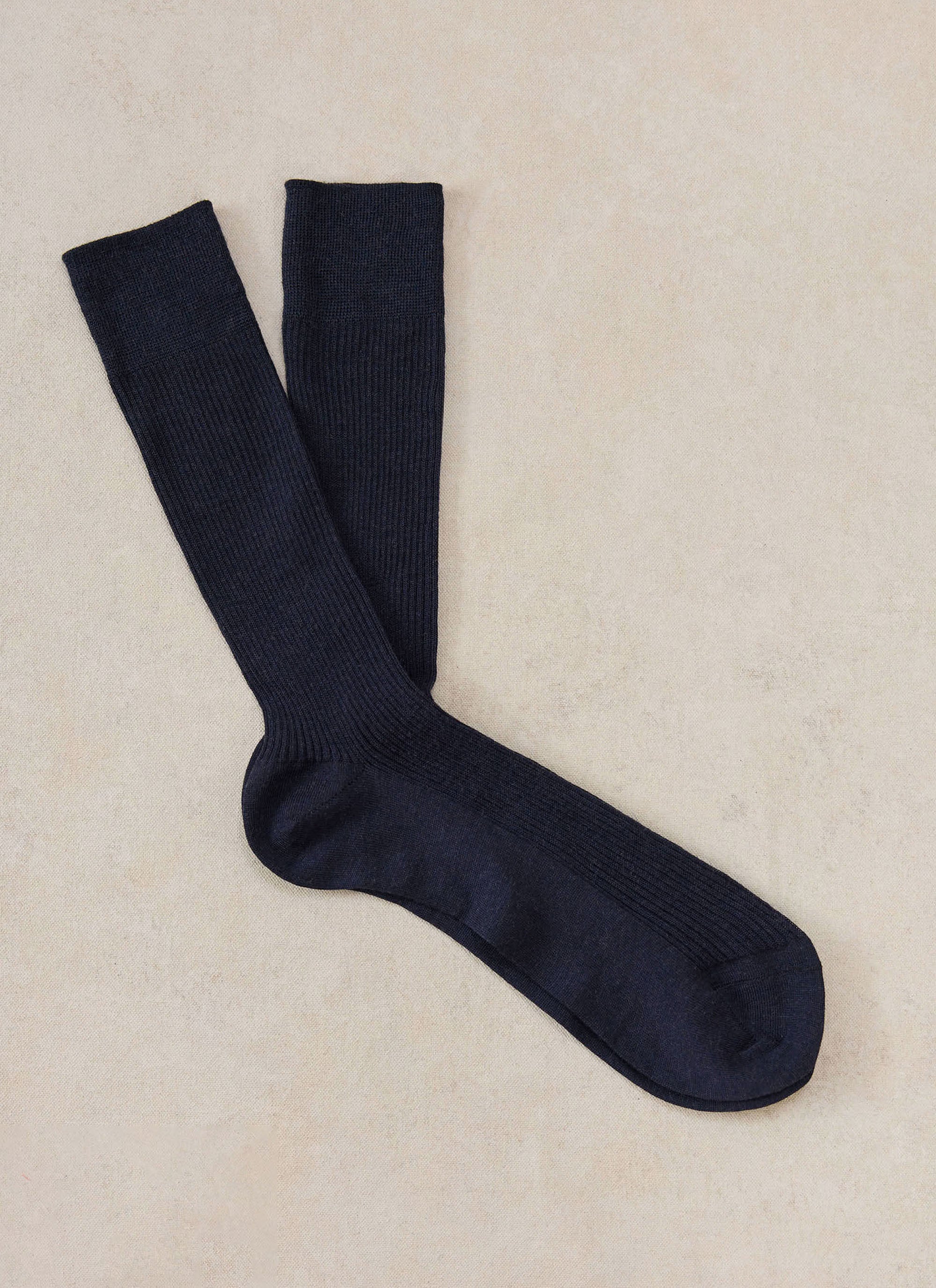 A flat lay of navy merino wool socks from Percival.