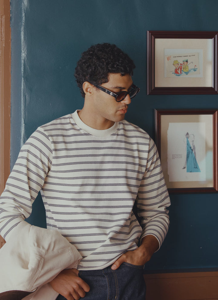A model wears the Arlo white stripe organic cotton Breton T-shirt from Percival.