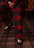 teal check track pants styled with printed loafers