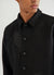 black jacket with black embroidery of and ice cream and a tomato