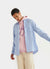 pink hoodie with purple print of an aubergine with smiling face