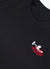 black sweatshirt with embroidery of boken red wine glass on left hand side of chest close up