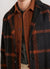 brown casentino overshirt styled with grey hikaru zipper and teal check coat