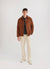 brown casentino overshirt styled with grey hikaru zip and beige trousers