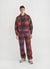 teal check track pants styled with matching teal check quarter zip and grey trainers