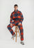 teal check track pants styled with matching teal check quarter zip and grey trainers