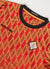 red football shirt with diamond shapes close up
