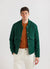forest casentino wool bomber jacket styled with rust knitted shirt and white trousers