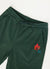 Forest green trackpants with orange octopus embroidery on left thigh close up