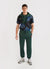 Black football shirt with large navy octopus prints, styled with green track pants and jacket