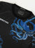 Black football shirt with large navy octopus prints close up