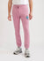 Pink trackpants with blue octopus embroidery on left thigh