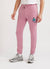 Pink trackpants with blue octopus embroidery on left thigh