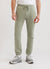 Pistachio green trackpants with orange octopus embroidery on left thigh