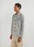 white and black striped long sleeve shirt with black print of a tomato on front pocket