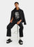 black short sleeve t shirt with white print of a cartoon snail and text "quite tricky"