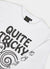 close up of white long sleeve t shirt with black print of a cartoon snail and text "quite tricky"