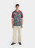 short sleeve football shirt with blue and brown diamond shapes