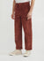 wide leg brown ankle gracing corduroy trousers styled with beige converse
