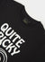 close up of black short sleeve t shirt with white print of a cartoon snail and text "quite tricky"